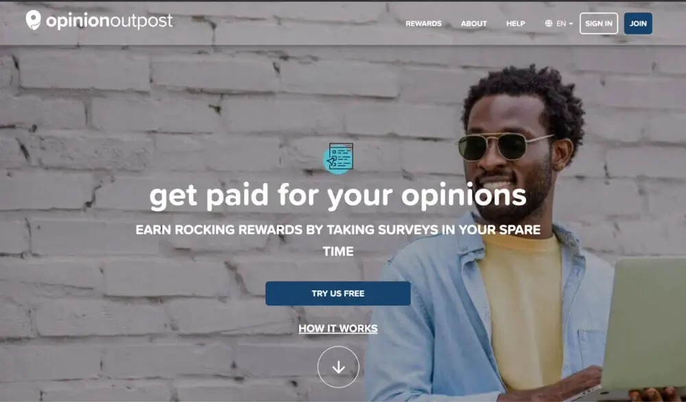 Opinion Outpost Hero with a title, a "Try Us Free" button, a link to How It Works, a nav menu with more options, and a background image of a young man holding a laptop against a white-painted brick wall.